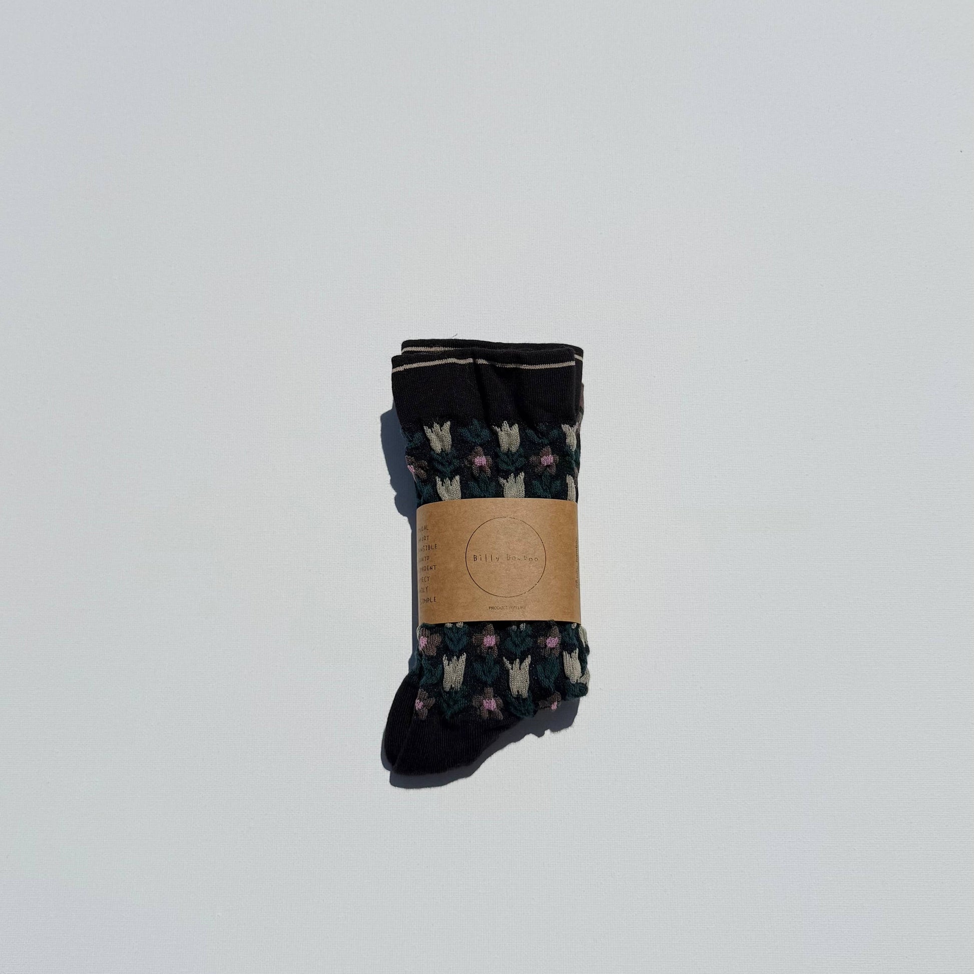 Pair of socks with a pattern on a light gray background